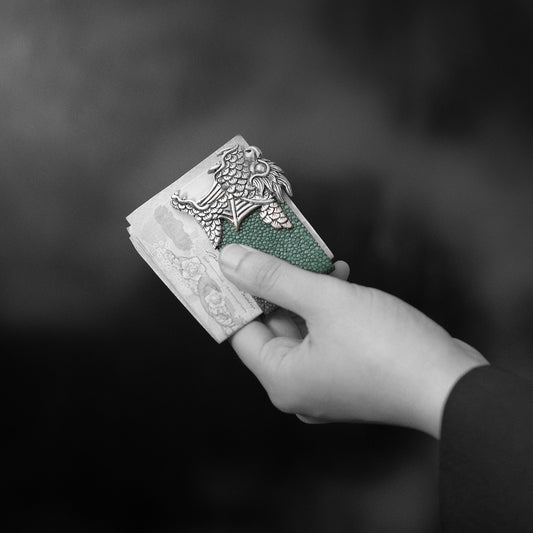 Man holding Galuchat Leather Money Clip with Dragon Fish