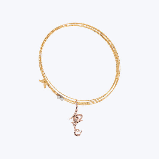 18K Yellow Gold Wire Bracelet with Gold Flower and a Love Pendant with Diamond