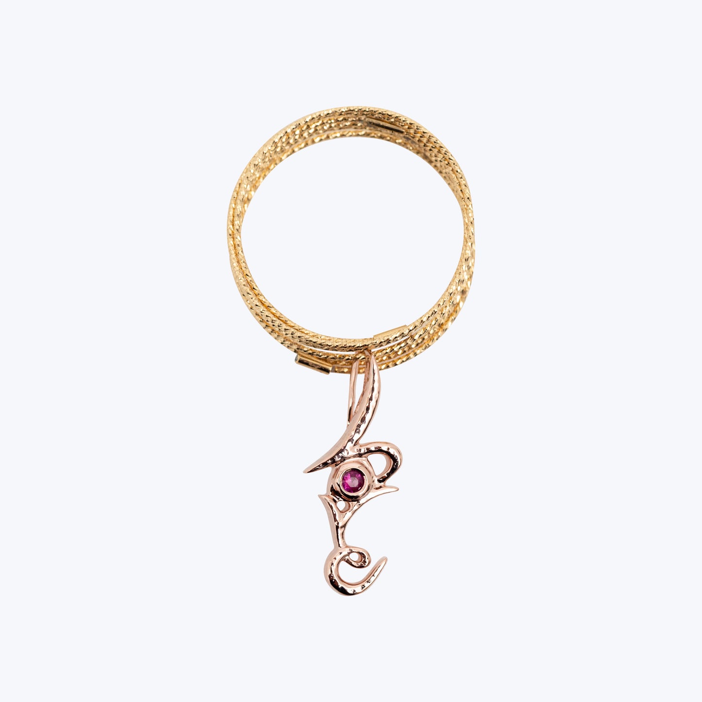18K Yellow Gold Wire Stretchable Ring with a Love Pendant with Ruby in 9K Pink Gold